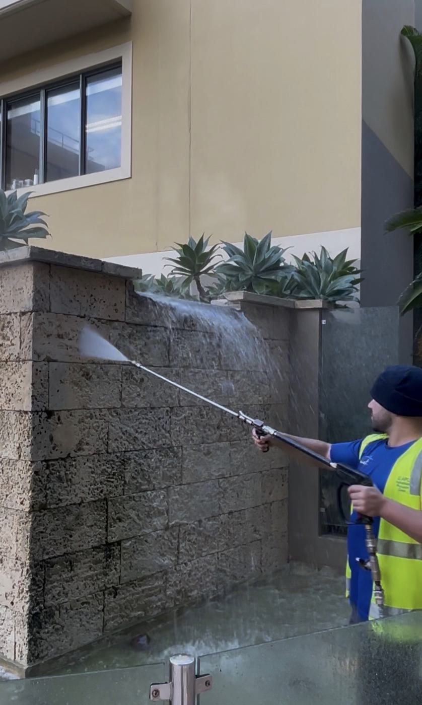 Wall and exterior surface pressure washing